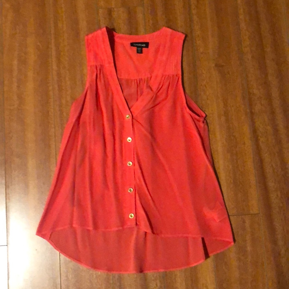 Bebe sleeveless silk button down top. 100% silk